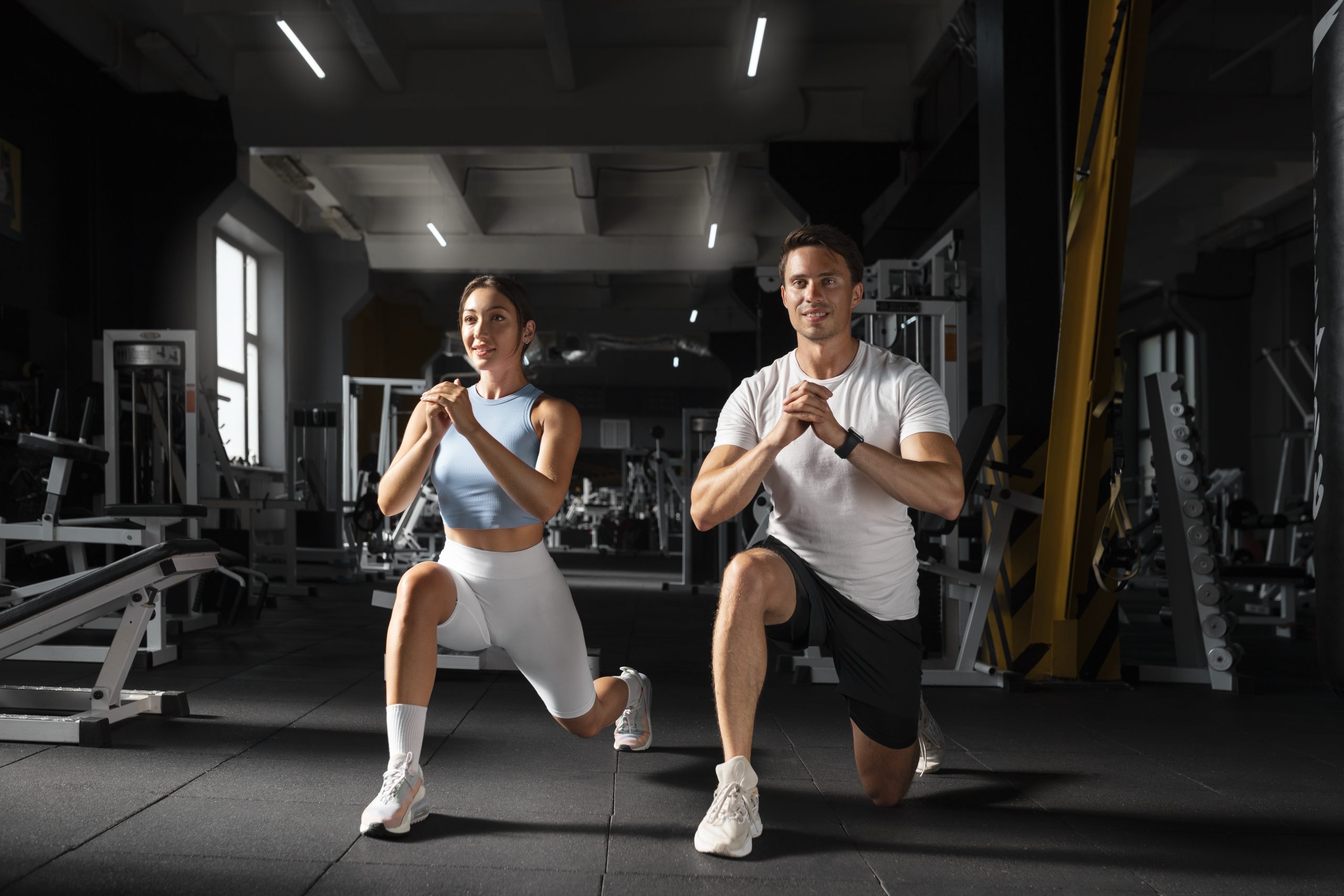 woman-helping-man-gym